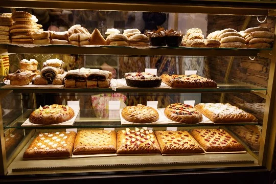  Bakeries are establishments with a wide range of bread and pastries, drinks, snacks, confectionery, and main courses.